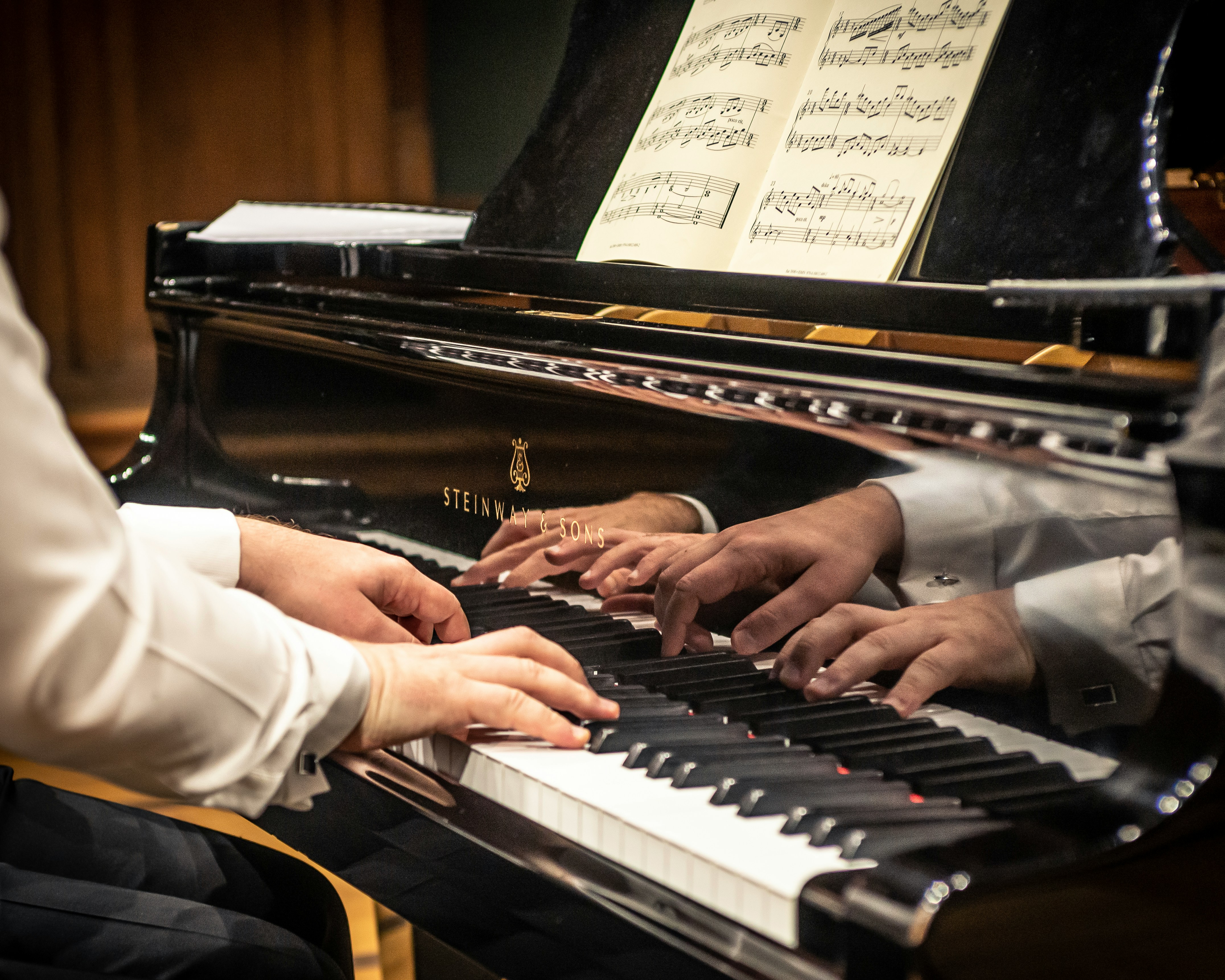 Photo of a pianist playing the piano courtesy of unsplash