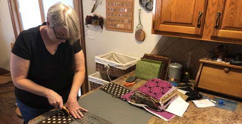 Rhonda Meyerhoff busy at work making masks